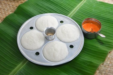 Many Idli or idly in molding plate with coconut chutney