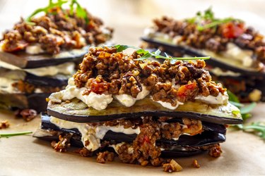Aubergine lasagna on baking paper, vegetarian