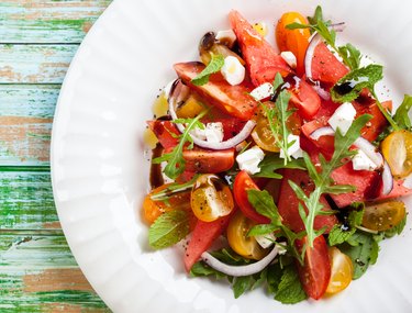 Top view of a watermelon and tomato salad