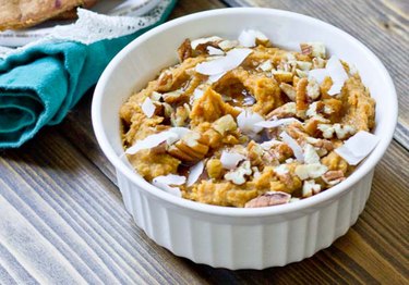 Sweet Potato Pie Dessert Hummus in a white bowl with coconut flakes