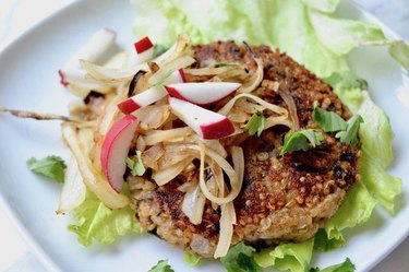 Sweet potato, black bean and quinoa burger on a white plate.