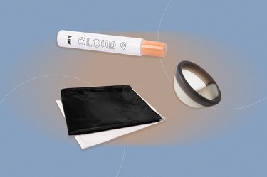 A Cycleliners bed sheet protector, Cora menstrual disc and Blume Cloud 9 essential oil on a blue background.