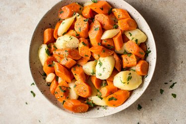 Instant Pot Parsnips and Carrots in a white plate on countertop.
