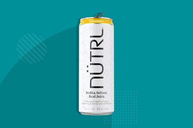 Nütrl vodka seltzer canned cocktail on blue background