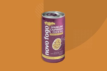 Novo Fogo Sparkling Caipirinhas canned cocktail on orange background