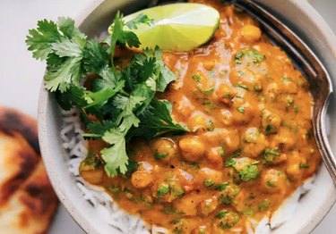 A close up of pumpkin curry on a bowl of white rice