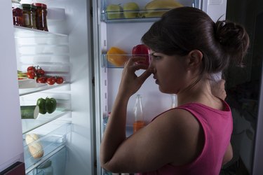 Woman holding nose