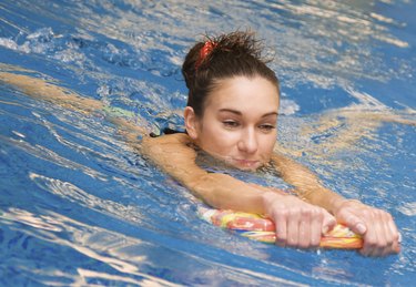 young girl is swimming